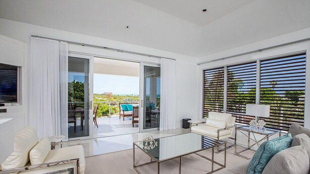 Luxury Penthouse, Ensuite, Partial Ocean View | Living room | Flat-screen TV, DVD player - Amani Suite (Providenciales)
