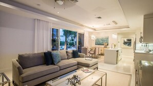Luxury Condo, Ensuite, Pool View | Living room | Flat-screen TV, DVD player - Bahari & Kutulia (Providenciales)