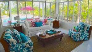Deluxe Villa, 3 Bedrooms, Jetted Tub, Pool View | Living room | Flat-screen TV, DVD player - Beach Daze (Providenciales)