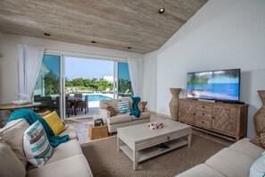 Premium Villa, Ensuite, Canal View | Living room | Flat-screen TV, DVD player - Sea Foam Villa (Providenciales)