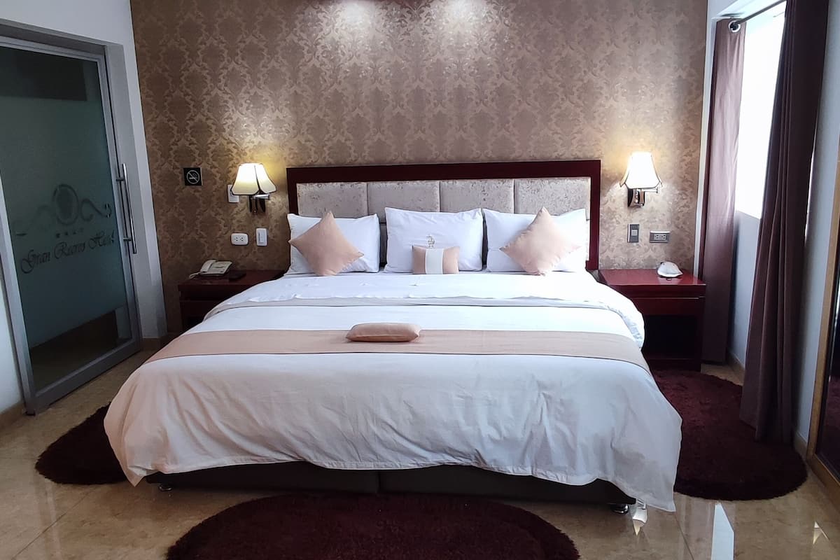 superior suite | minibar, in-room safe, desk, blackout curtains