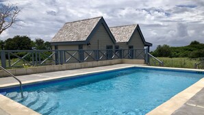 Outdoor pool, open 6 AM to 9 PM, pool umbrellas, sun loungers