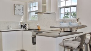 Coffee/tea maker, fridge, microwave, oven