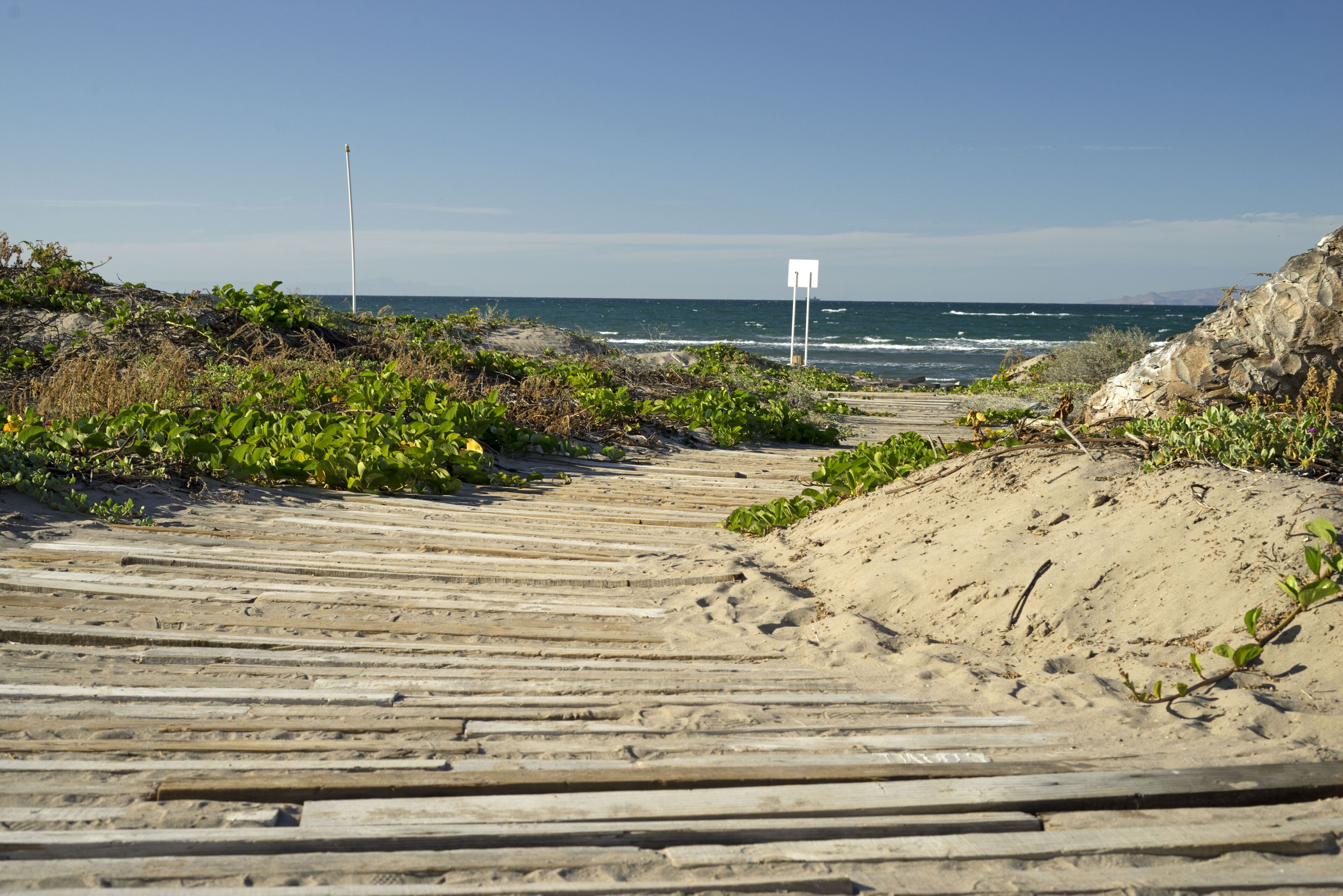 On the beach, sun-loungers, beach towels