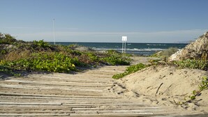 A wooden boardwalk leading to the beach with a clear view of the ocean. - BeachFront, Golf, Heated pool, Tennis,Netflix, Gym, Pickleball (La Paz)