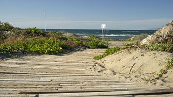 On the beach, sun-loungers, beach towels