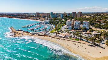 On the beach, sun loungers, beach towels