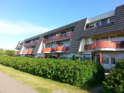 Ameland - apartment with balcony to the south side with a view of meadows and the village of Buren