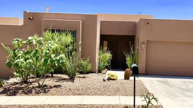A modern house with a garage, a small garden with cacti and shrubs, and a mailbox. - Starr Pass Escape 3 Bedroom (TUCSON)