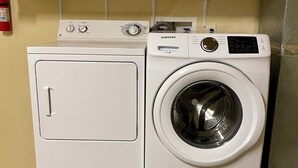 A front-loading washing machine and dryer side by side in a laundry room. - Starr Pass Escape 3 Bedroom (TUCSON)
