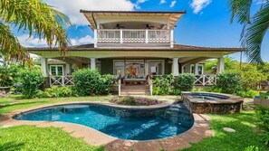 Enjoy a tranquil stay in this two-story house with a spacious balcony and pool.