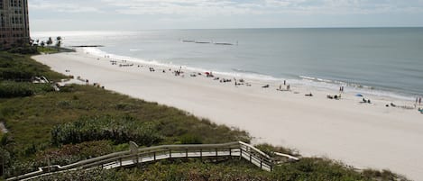 On the beach, sun loungers, beach towels