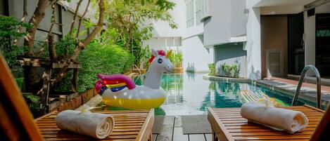 Outdoor pool, open 7:00 AM to 10:00 PM, pool umbrellas, sun loungers