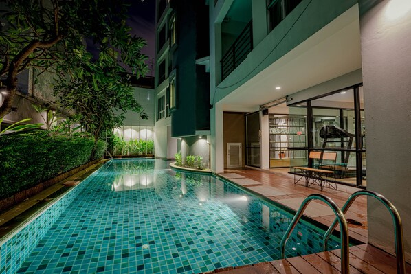 Outdoor pool, open 7:00 AM to 10:00 PM, pool umbrellas, pool loungers