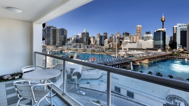 A balcony with a city view, including a bridge and water body. -  Luxury 2 bedroom apartment Sydney, Darling Harbour, ICC and free secure parking (Sydney)