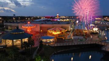 A water park with a carousel, a water slide, and a Ferris wheel.
