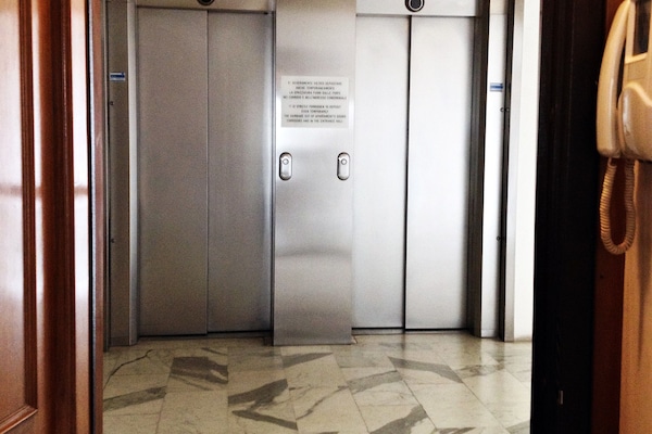 Elevators in front of the entrance door
