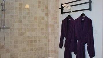 Shower, hair dryer, towels, shampoo