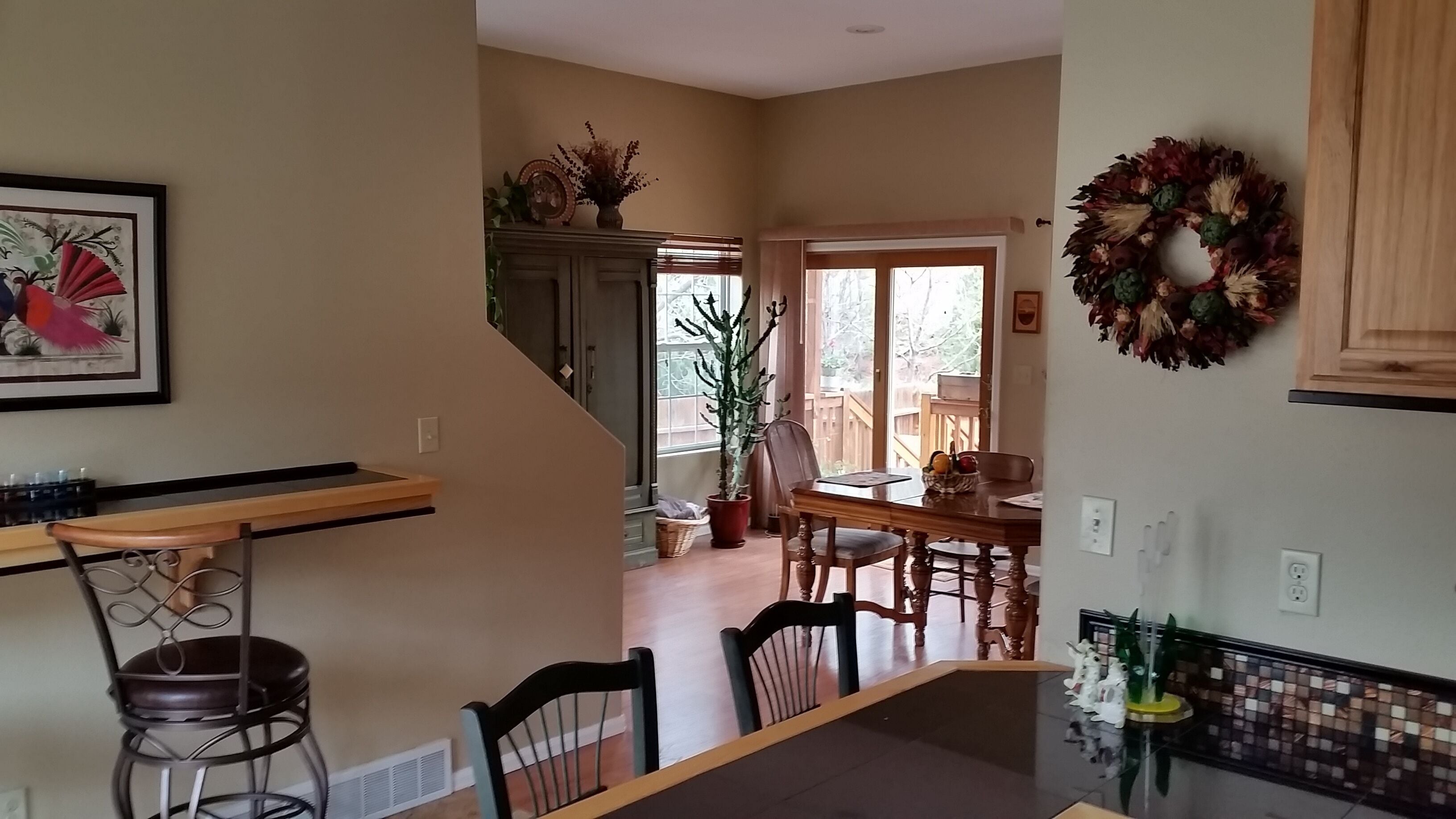 Another shot from kitchenette showing dining area and rear door to backyard