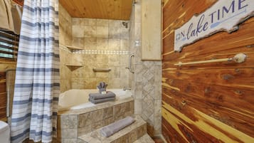 Bathtub, jetted tub, hair dryer, towels
