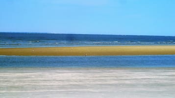 On the beach, sun-loungers