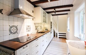 Fridge, stovetop, dishwasher, coffee/tea maker