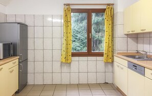 Fridge, stovetop, dishwasher, coffee/tea maker