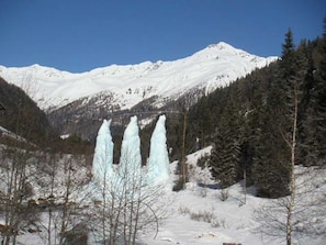 A snowy mountain landscape with a clear sky.
