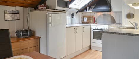 Fridge, stovetop, dishwasher, coffee/tea maker