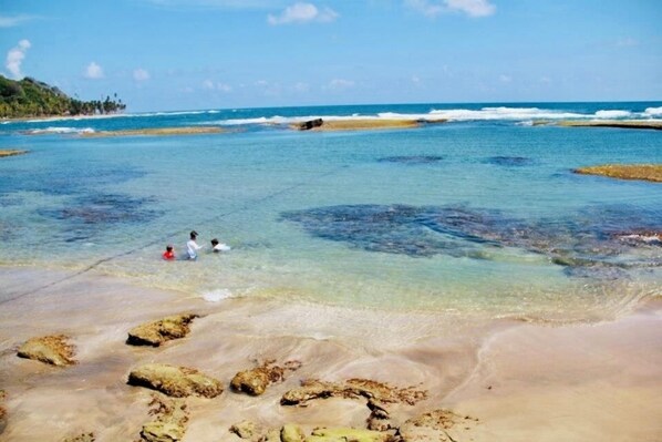 On the beach, sun loungers, beach towels