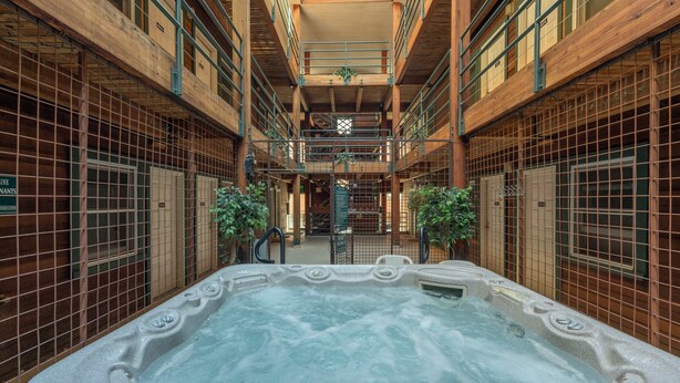 A spa area with a hot tub, wooden walls, and a skylight. - Can't Beat Location! Enjoy the Balcony, Close to Gondola & Town Park (Telluride)