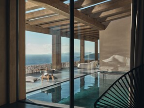 A modern infinity pool with a clear view of the sea and mountains. - Vais luxury villas (Zakynthos)