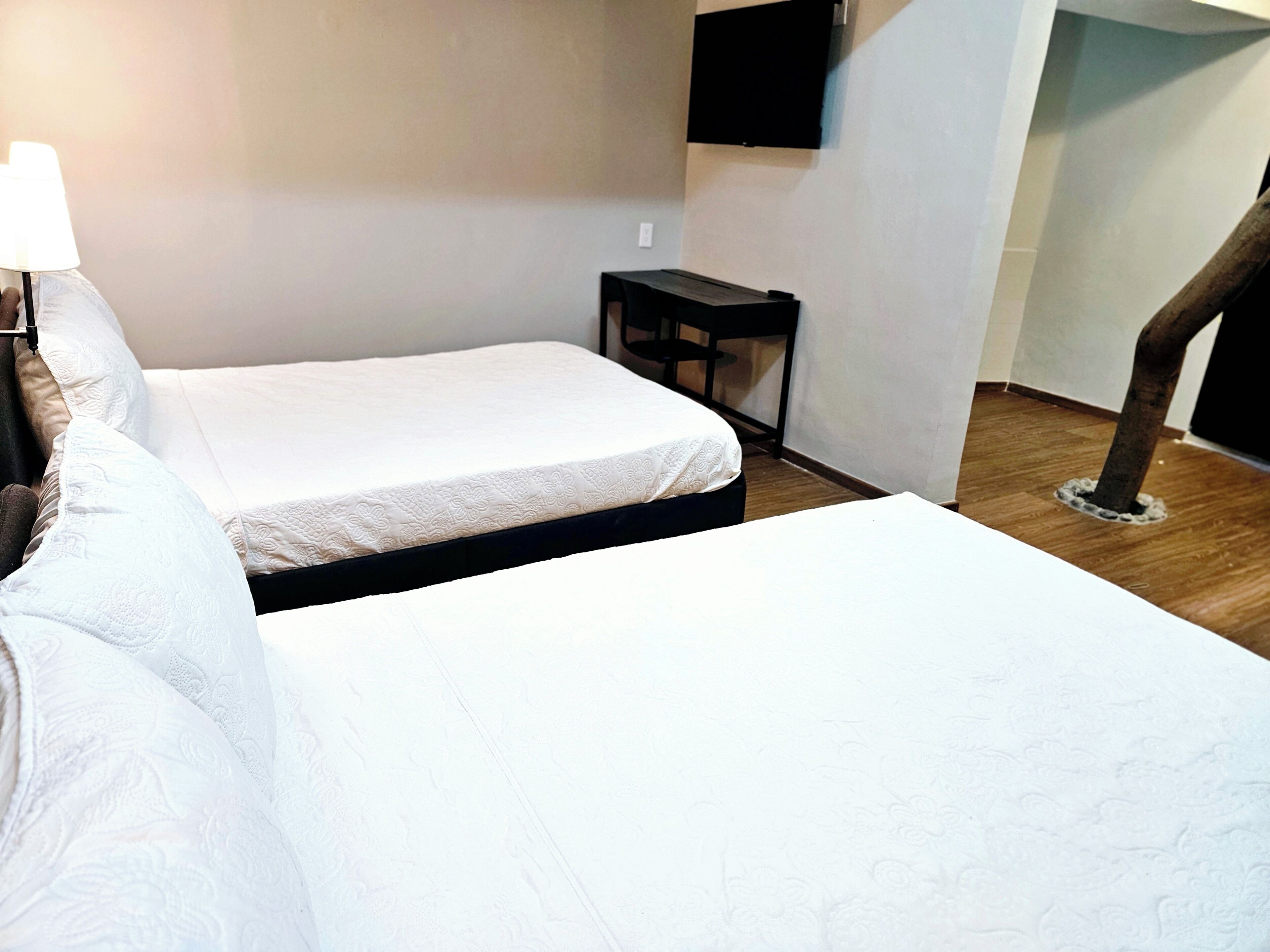 Family Room, 2 Double Beds | Blackout drapes, iron/ironing board, free WiFi, bed sheets