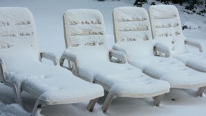 Four snow-covered lounge chairs arranged in a row. - Deluxe Condo -complimentary shuttle to ski- Best location, comfort & style (Park City)