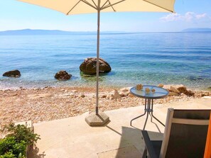 On the beach, sun loungers