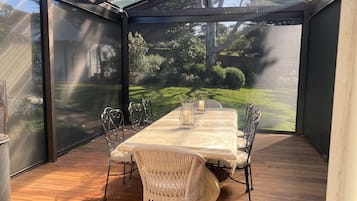 Enjoy dining al fresco in this serene garden setting, surrounded by lush greenery and a tranquil atmosphere.