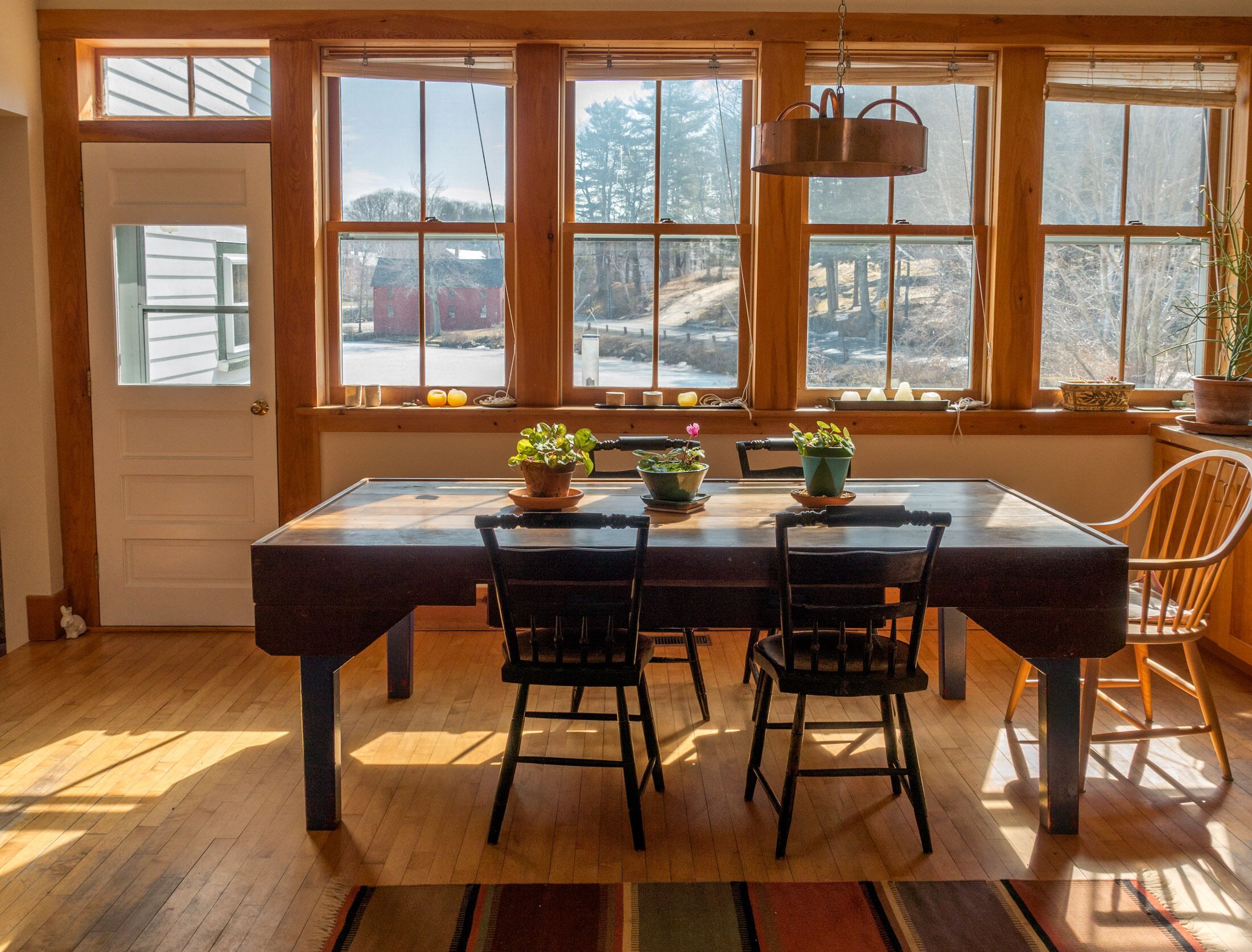The light-filled dining area has a marvelous view of the lake and town.