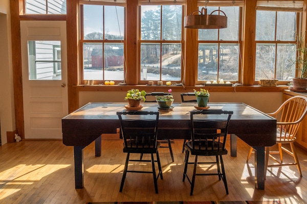 The light-filled dining area has a marvelous view of the lake and town.