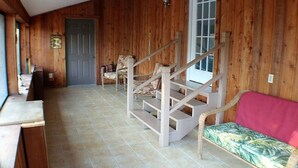 A wooden interior with a staircase, a bench, and a door. - LAKE ACCESS & GREAT VIEWS! MINUTES TO THE WHITE RIVER!! 3 BR/2BA, 1500 sq. ft. (Bull Shoals)