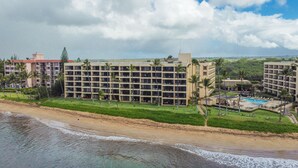 A resort with multiple buildings, a beach, and a pool area. - Amazing Ocean Front at Sugar Beach Resort #519, High End Remodel, 1Bed/1Bath (Kihei)