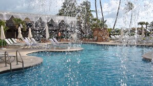A pool with water jets, lounge chairs, and umbrellas. - Beach Front Resort - 2 Bedroom, 2 bathrooms, Sleeps 6, 2 Pools- at The Alexander (Miami Beach)