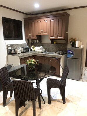 City Apartment, 2 Bedrooms | Private kitchen | Full-size fridge, stovetop, electric kettle, rice cooker - Cranberry's Place (Iloilo)