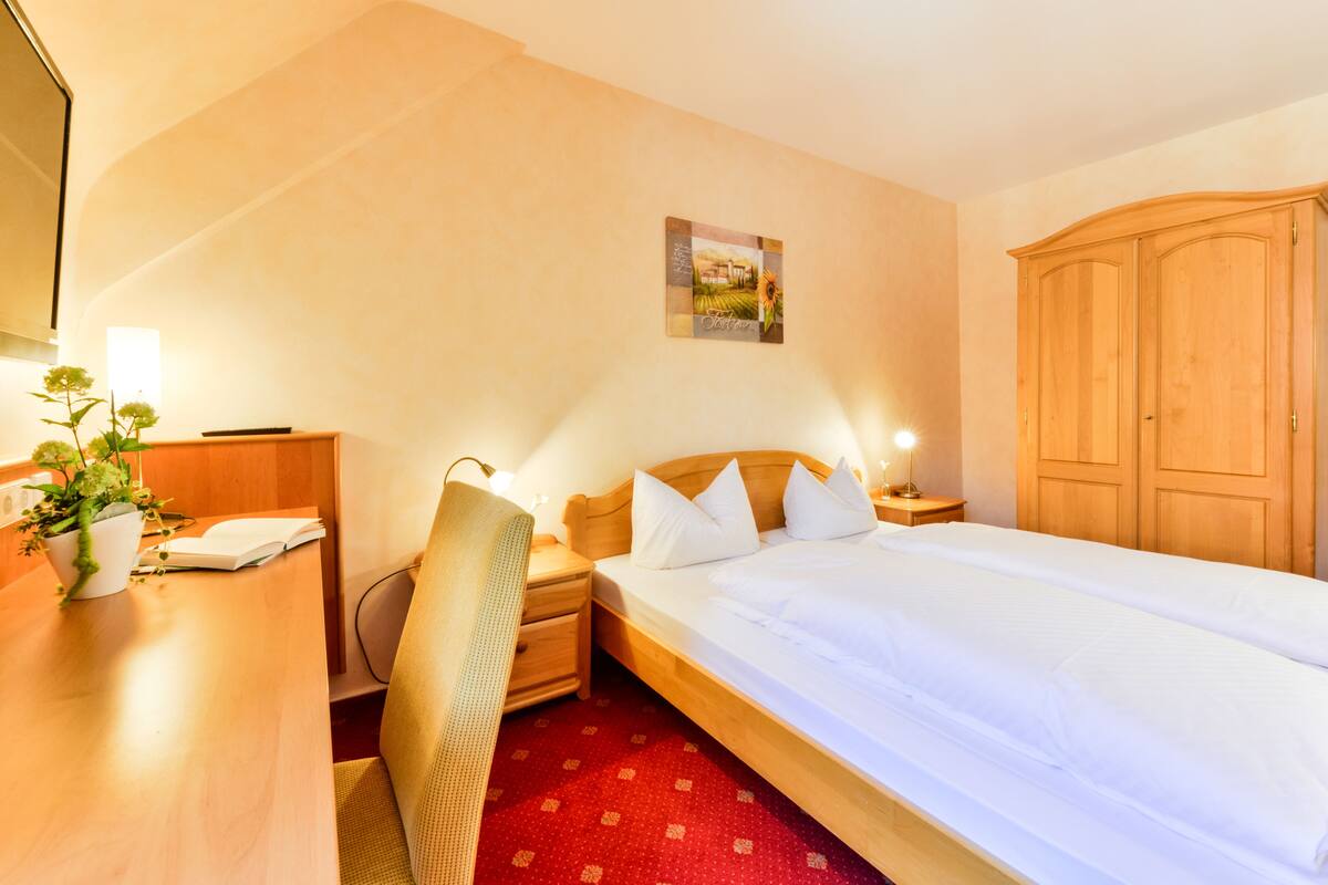 Een kluis op de kamer, gratis wifi, beddengoed