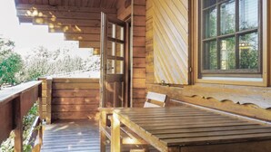 A wooden cabin with a porch, a bench, and a window. - 2 bedroom nice home in Schlitz-Rimbach (Schlitz-Rimbach)