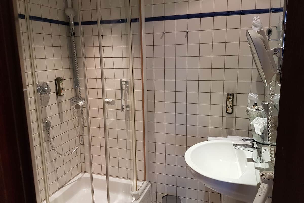 Shower, free toiletries, hair dryer, slippers