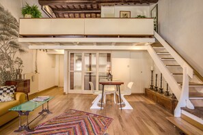 Loft, City View | Living area | Flat-screen TV, fireplace