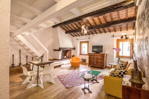Loft, City View | Living area | Flat-screen TV, fireplace