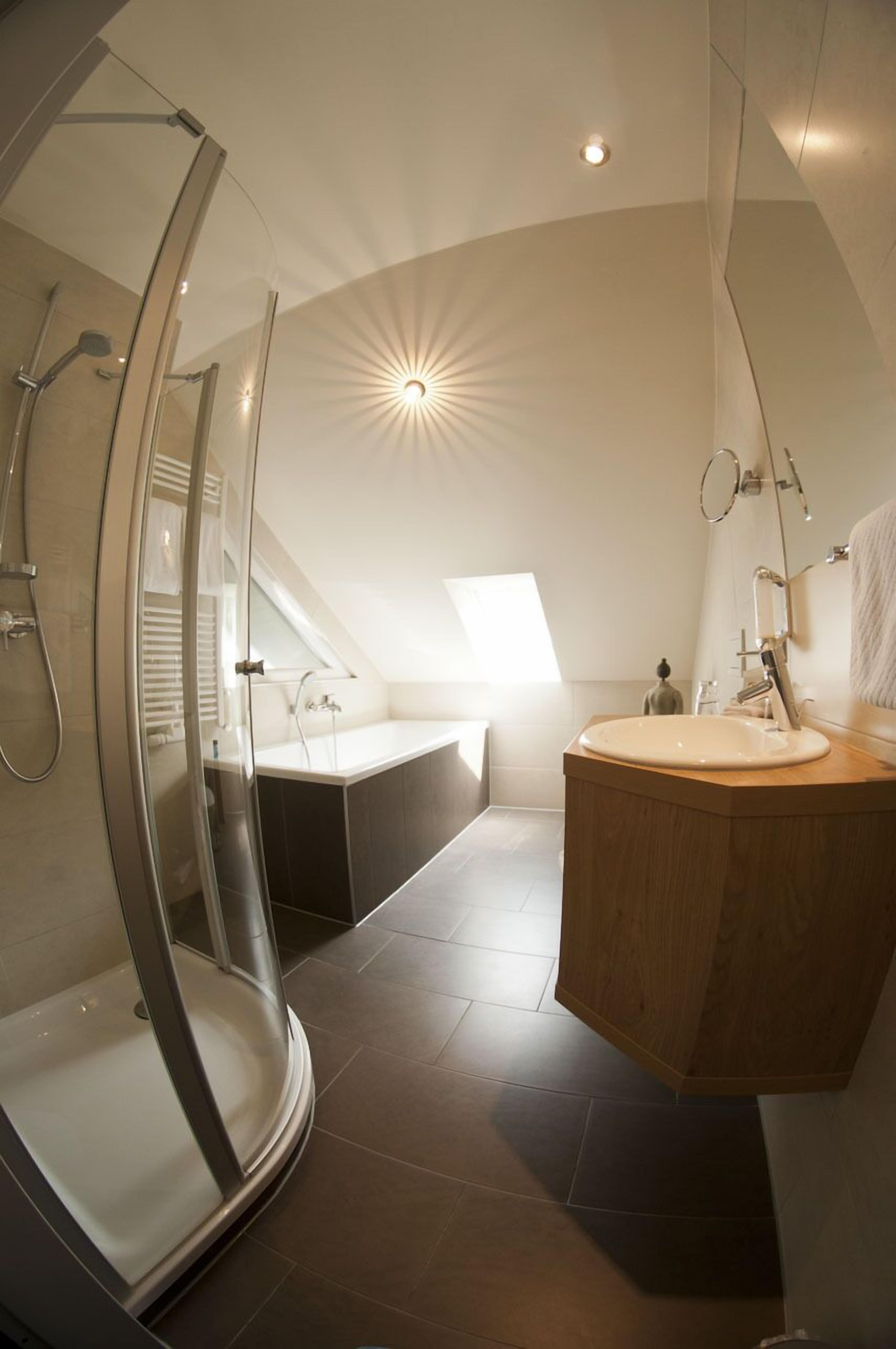 comfort suite | bathroom | shower, hair dryer, towels
