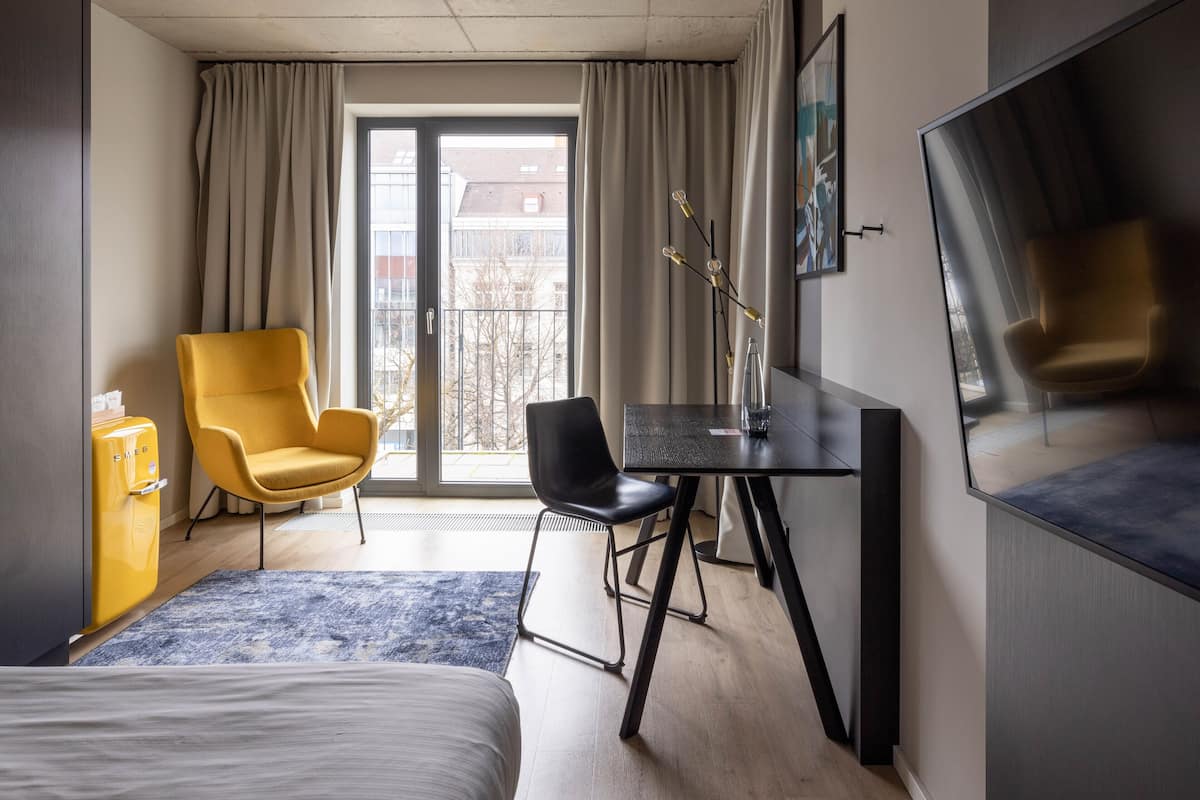 Medium Room with Balcony - Single Bed | Living area | 43-inch flat-screen TV with cable channels, TV, streaming services