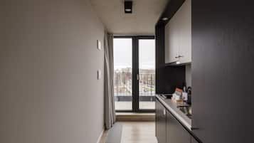 Medium Studio with Kitchen and Balcony | Living area | 43-inch flat-screen TV with cable channels, TV, streaming services